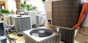hvac-technician-removing-old-rusted-broken-aircond-2025-02-15-16-37-40-utc